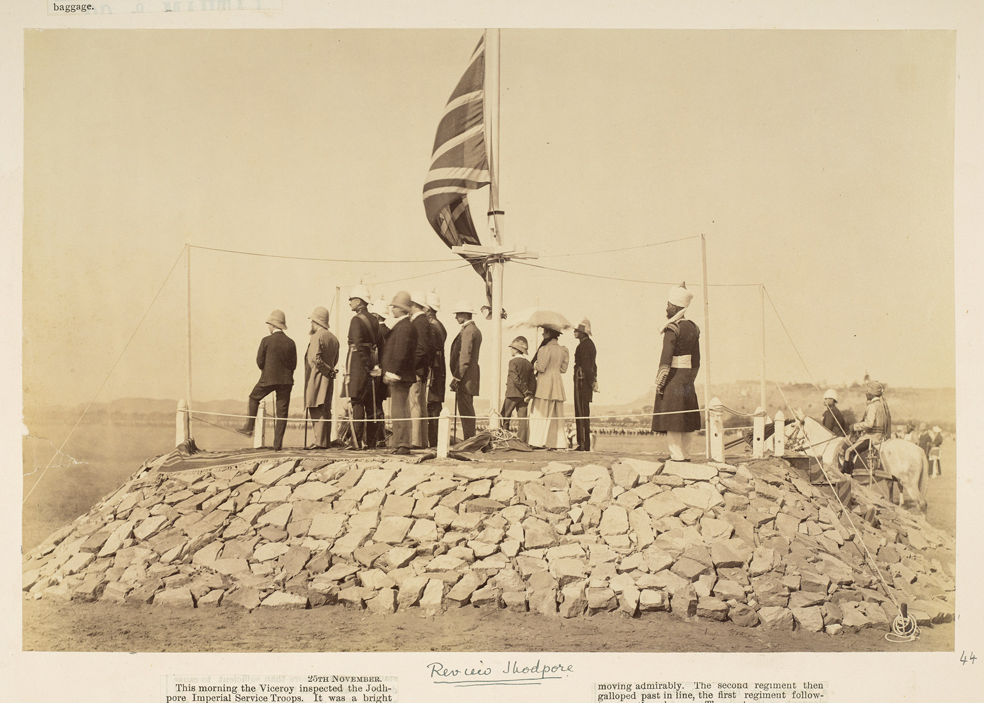 Army troops with flag watching in distance